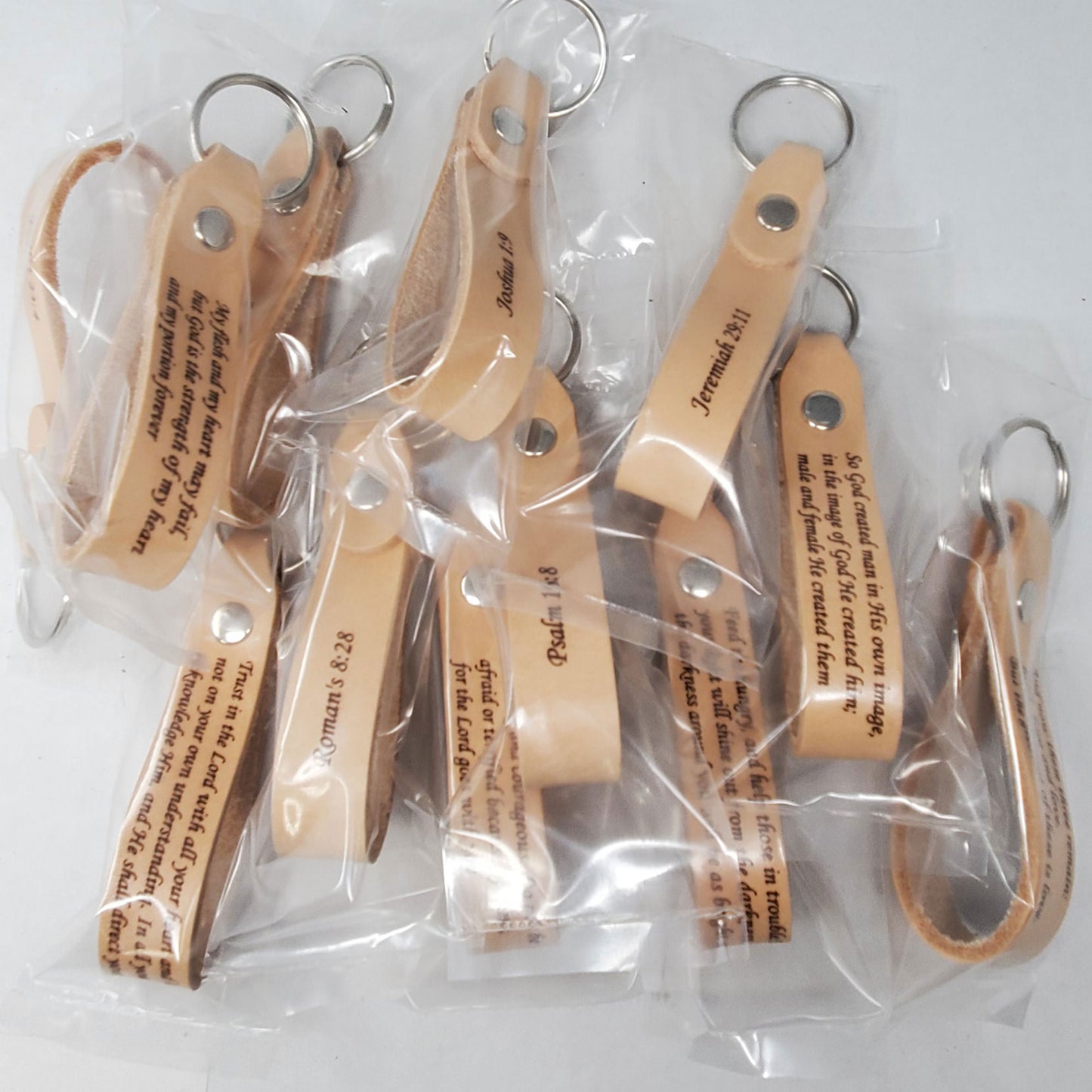 Single packed Bible Verse leather keychains laser engraved ready for shipping.