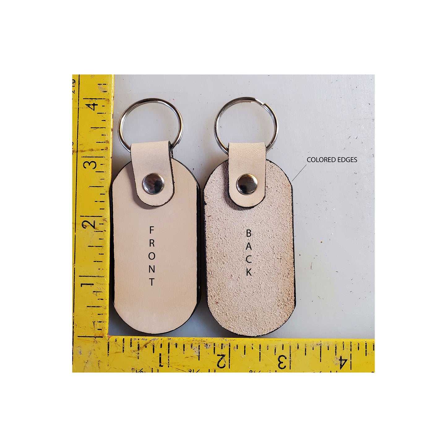 Oval leather keychains front and back as well as measurement