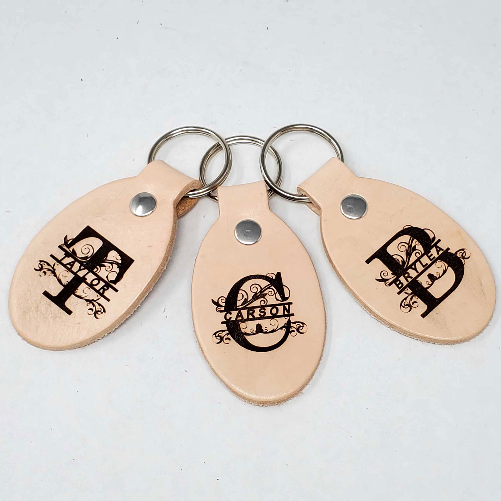 Blank leather keychains, high-quality and customizable. Here are samples of monogramed leather keychains